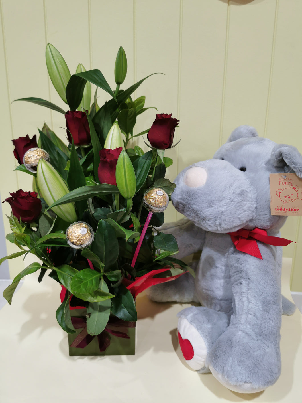 Red Roses Arrangement with A Puppy