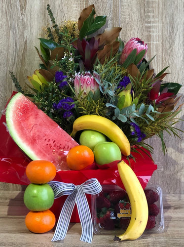 assortment of fresh fruit and a native-inspired floral arrangement