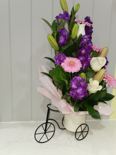 Flower Arrangement In A Bicycle Pot
