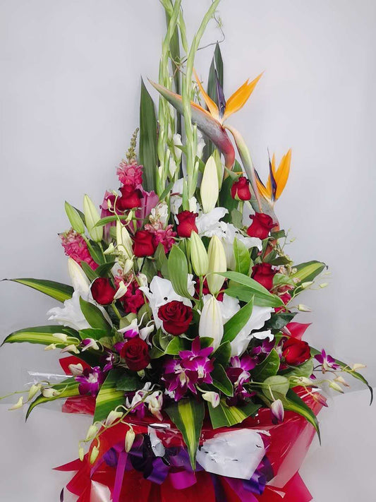 Large A-frame flower arrangement in a wooden box.