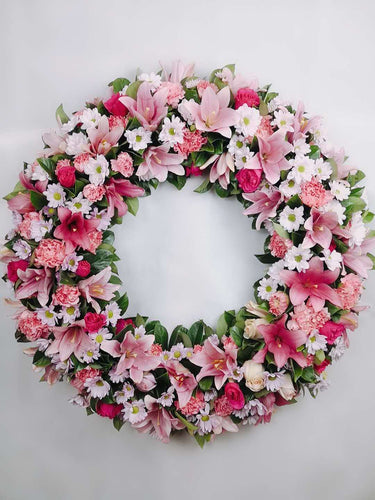 large wreath with a sophisticated blend of natural foliage